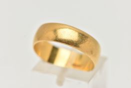 A YELLOW METAL WIDE POLISHED BAND, approximate band width 6.2mm, stamped 22 carat, ring size N,