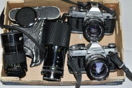 VINTAGE CANON PHOTOGRAPHIC EQUIPMENT, comprising two Canon AE-1 35mm SLR camera bodies, a Canon 50mm