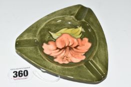 A MOORCROFT POTTERY 'HIBISCUS' PATTERN TRIANGULAR ASHTRAY, tube lined with hibiscus flowers on a