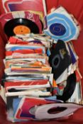 A BOX OF APPROXIMATELY 150 7 INCH SINGLES, MUSIC FROM THE 1960'S 1970'S AND 1980'S, to include