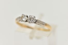 A TWO STONE DIAMOND RING, two round brilliant cut diamonds prong set in white metal, approximate