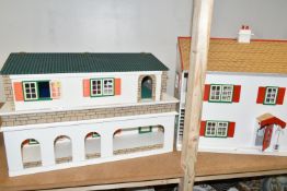 TWO WOODEN DOLL'S HOUSES, one modelled as a detached house with side garage, front opening, the