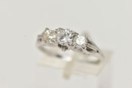 A THREE STONE DIAMOND RING, a centrally set old European cut diamond with two round brilliant cut