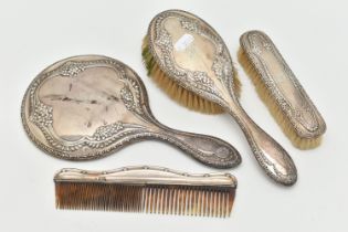 AN EARLY 2OTH CENTURY SILVER DRESSING TABLE SET AND A COMB, the set including a mirror and two
