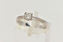 A SINGLE STONE DIAMOND RING, a round brilliant cut diamond four prong set in white gold, leading