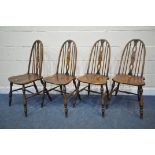 A SET OF FOUR REPRODUCTION ELM SEATED SPINDLE BACK CHAIRS, on turned legs and stretchers (