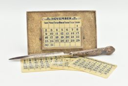 A GEORGE V SILVER MOUNTED SHAGREEN PERPETUAL DESK CALENDAR OF RECTANGULAR FORM, with seven double