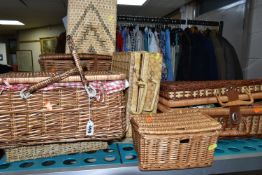 A SELECTION OF WICKER BASKETS, to include a picnic basket with BHS Priory cups and saucers and BHS