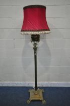 A HEAVY HINKS BRASS STANDARD LAMP, converted from a paraffin lamp, with a Corinthian pillar, on a