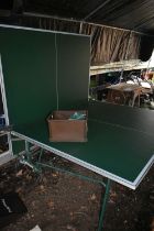 A KETTLER SPORT FOLDING TABLE TENNIS TABLE, with a box containing accessories, and a water resistant