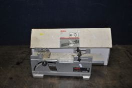 A BOSCH ADV-82 PLANER STAND and a Boxed MT-65 router fence with extraction nozzle (2)