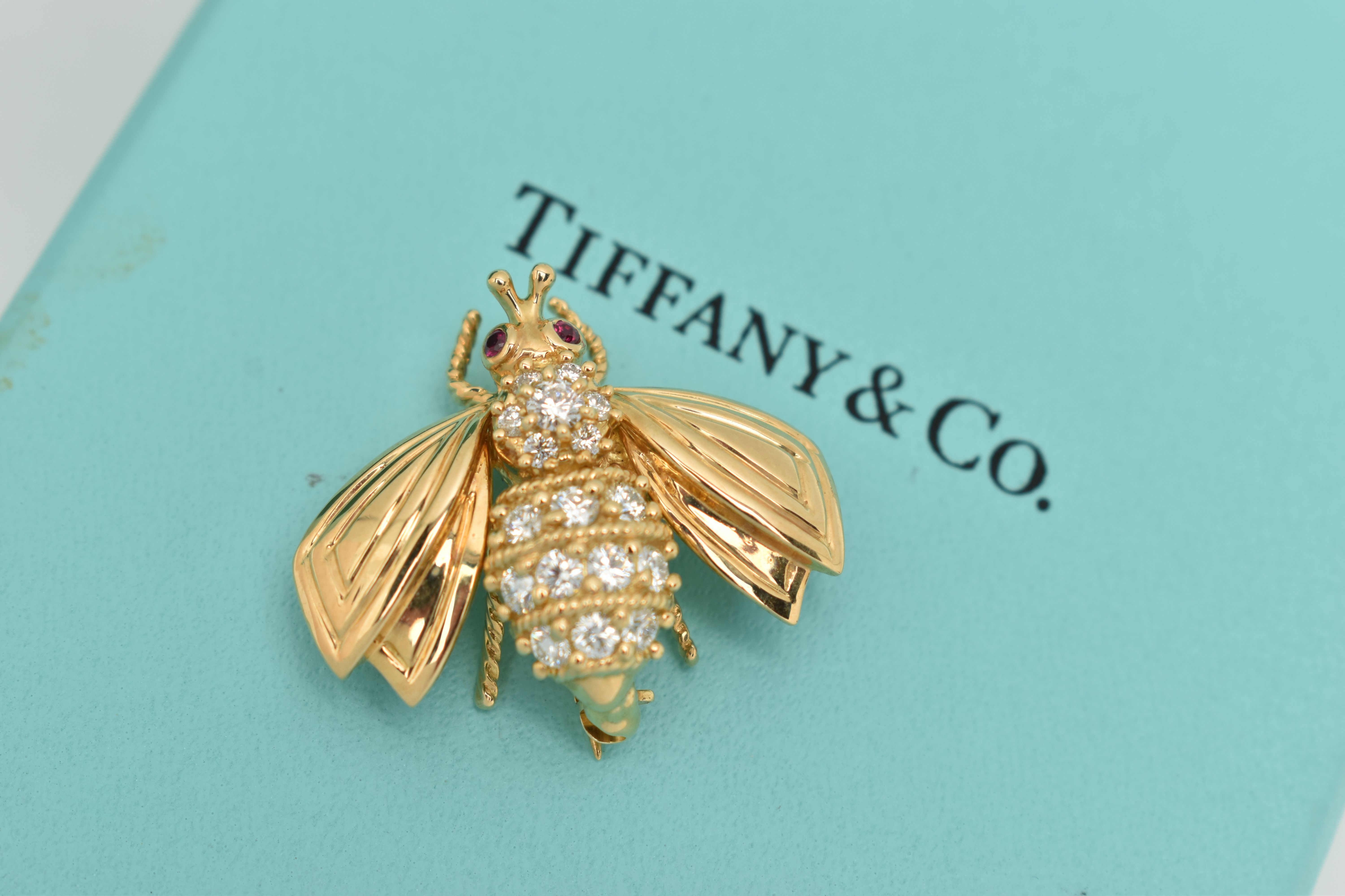 TIFFANY & CO. DIAMOND AND RUBY BEE BROOCH, the body claw set with brilliant cut diamonds, to the - Image 3 of 5