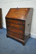 THEODORE ALEXANDER, A REPRODUCTION MAHOGANY BUREAU, the fall front door enclosing a fitted interior,