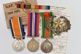 THREE WWII MEDALS, to include two 1939-1945 service medals, both with ribbons, a 1939-1945 The