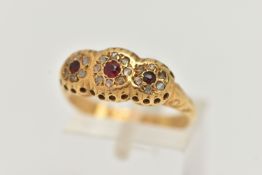 A 1930'S 18CT GOLD GARNET AND DIAMOND RING, designed as three graduated circular garnets within