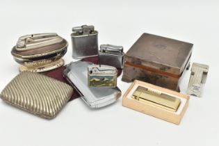 A SILVER TABLE TOP BOX AND LIGHTERS, square engine turned pattern box, vacant cartouche, raised on