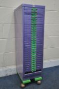 A PURPLE PAINTED METAL THIRTY DRAWER FILING CABINET, on later castors width 28cm x depth 44cm x