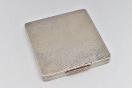 A SILVER 1940S COMPACT, of a square form, engine turned pattern, gilt interior with mirror,