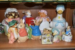 A GROUP OF BEATRIX POTTER CHARACTER COOKIE JARS AND CERAMICS, comprising four cookie jars a '