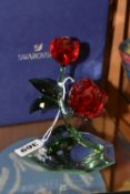 A BOXED SWAROVSKI 'RED ROSE' 5424466, on a mirrored stand, part of the Swarovski Crystal Paradise