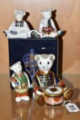 A BOXED ROYAL CROWN DERBY 'DRUMMER BEAR' PAPERWEIGHT AND THREE MINIATURE TEDDIES FIGURES, comprising