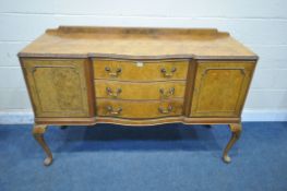 A QUEEN ANNE STYLE WALNUT SIDEBOARD, fitted with two cupboard doors, flanking three drawers, top