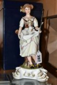 A BOXED ROYAL CROWN DERBY SHEPHERDESS FIGURINE, she is depicted holding a lamb in her apron and a