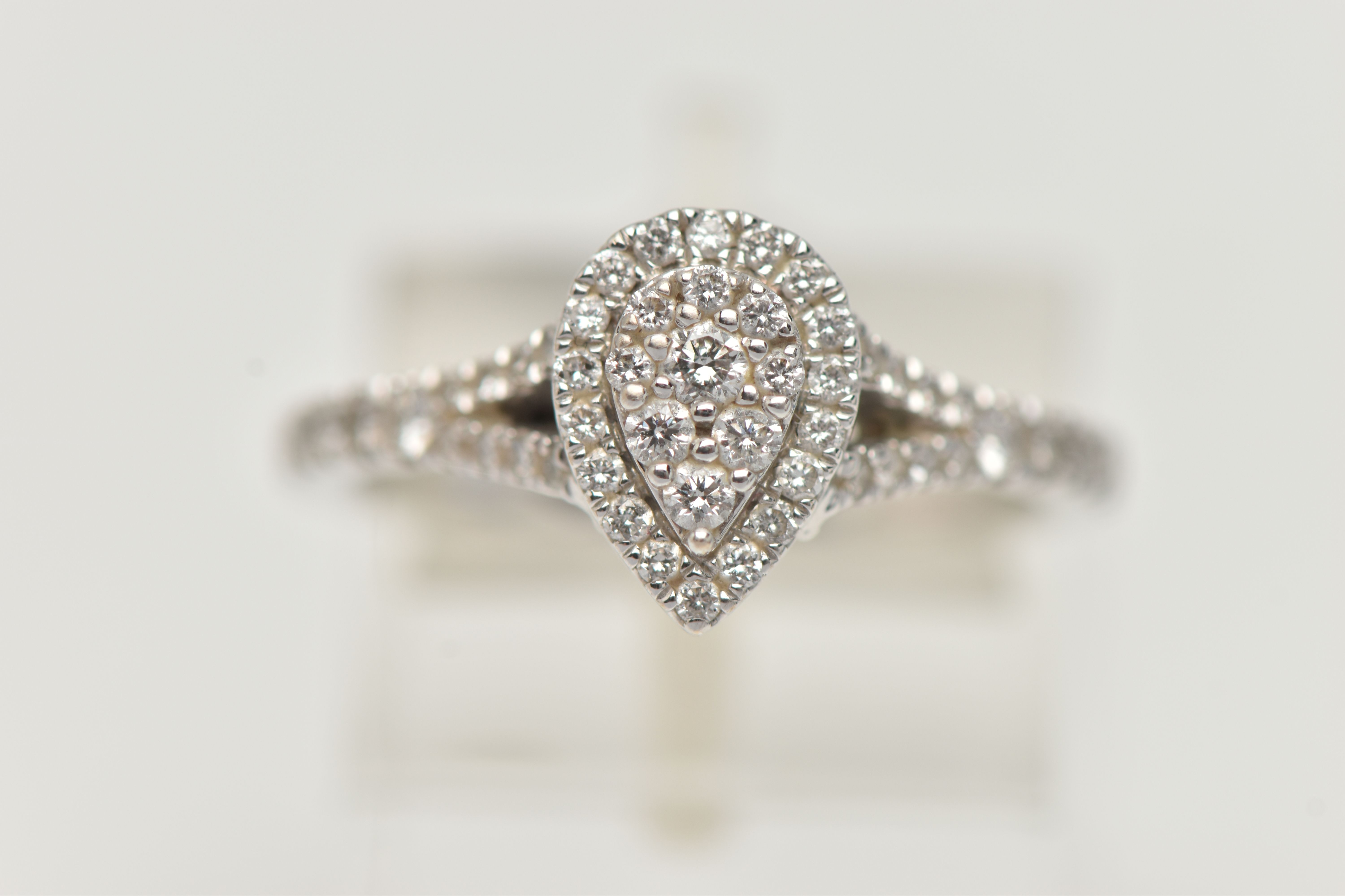 A 'VERA WANG', 18CT WHITE GOLD, DIAMOND SET RING, of a pear cut design, set with a cluster of - Image 7 of 7