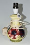 A SMALL MOORCROFT POTTERY 'ANEMONE' TABLE LAMP, having tube lined pink and purple anemones on a