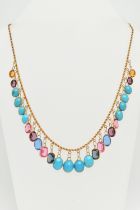 A GEM AND PASTE FRINGE NECKLACE, the rope twist chain suspending oval turquoise cabochons and oval