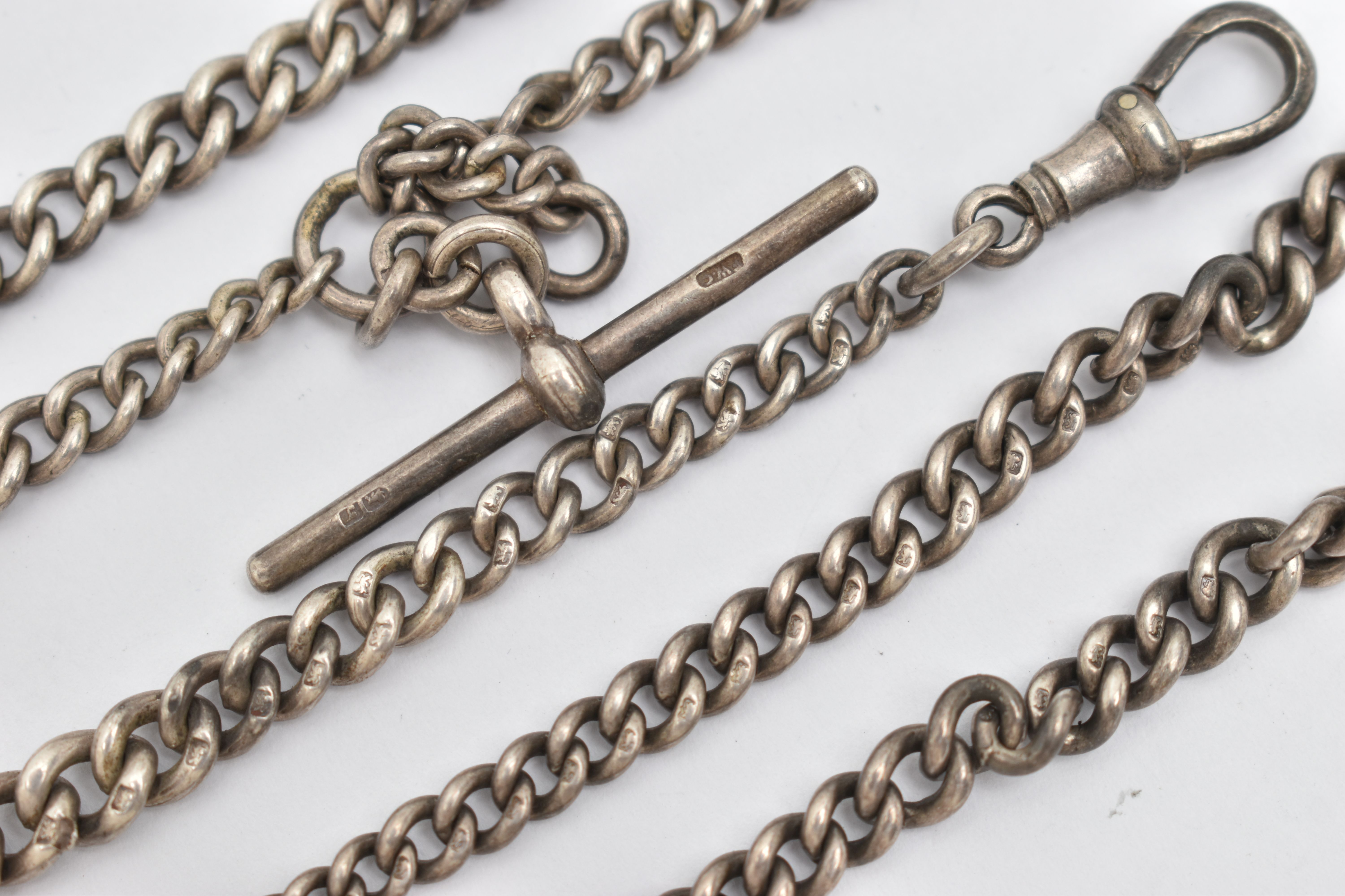 TWO EARLY 20TH CENTURY SILVER ALBERT CHAINS, the first a double Albert chain, with graduating curb - Image 2 of 2
