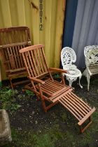 A PAIR OF TEAK FOLDING STEAMER CHAIRS (condition report: both weather finish, sturdy)