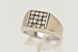 A GENTLEMAN'S DIAMOND SIGNET RING, the square panel set with eight brilliant cut diamonds and