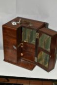 A GEORGE III MAHOGANY TRAVELLING APOTHECARYS CABINET, brass swan neck handle to the top, brass