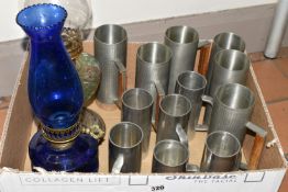A BOX OF MID TWENTIETH CENTURY PEWTER TANKARDS AND TWO OIL LAMPS, comprising a set of six tankards