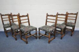 A SET OF SIX REPRODUCTION OAK LADDER BACK DINING CHAIRS, the top rail with scrolled carving, dark