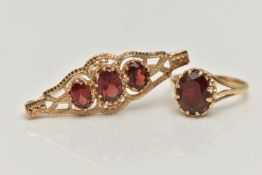 A 9CT GOLD RING AND YELLOW METAL BROOCH, an oval cut garnet, prong set in yellow gold leading on