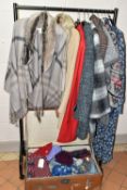 A RAIL OF LADIES WINTER CLOTHING AND A VINTAGE TRAVELLING TRUNK, comprising a Laura Ashley cape,