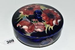 A MOORCROFT POTTERY 'ANENOME' COVERED BOWL, of shallow squat form, having tube lined blue and purple