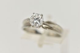 A WHITE METAL SINGLE STONE DIAMOND RING, round brilliant cut diamond in a six claw setting,