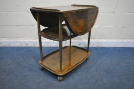 A STAINED ERCOL ELM AND BEECH THREE TIER DROP LEAF TEA TROLLEY, open width 96cm x closed with 48cm x