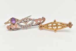 A RING AND TWO BROOCHES, an oval cut amethyst, prong set in yellow gold, leading on to scrolled
