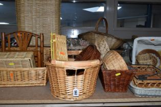 A LARGE QUANTITY OF WICKER BASKETS, comprising linen baskets, serving tray, letter rack, flower