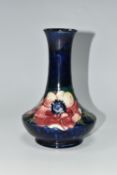 A MOORCROFT POTTERY VASE, tube lined in Anemone pattern on a cobalt blue ground, impressed and