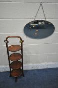 A HARDWOOD FOUR TIER CAKE STAND, height 86cm, along with an oval wall mirror (condition report: