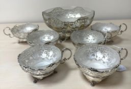 A GEORGE VI SILVER AND FROSTED GLASS LINED DESSERT SET, comprising a fruit bowl and six dishes,