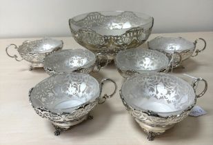 A GEORGE VI SILVER AND FROSTED GLASS LINED DESSERT SET, comprising a fruit bowl and six dishes,