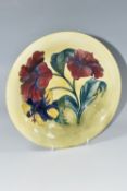 A MOORCROFT POTTERY HIBISCUS VASE, the footed bowl in 'Hibiscus' pattern on a yellow green ground,