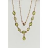 A YELLOW METAL PERIDOT NECKLACE, designed as a row of nine oval cut peridots, each in a claw