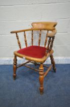 A 19TH CENTURY ELM BEECH AND ELM BOW TOP CAPTAINS/SMOKERS CHAIR, with burgundy fabric studded